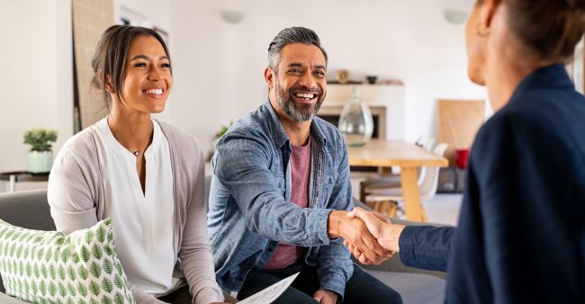 A couple choosing a real estate agent