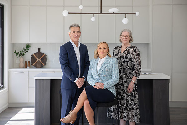 Photo - Damien Carter, Emma Vivian and Jane Reid from Miles Real Estate