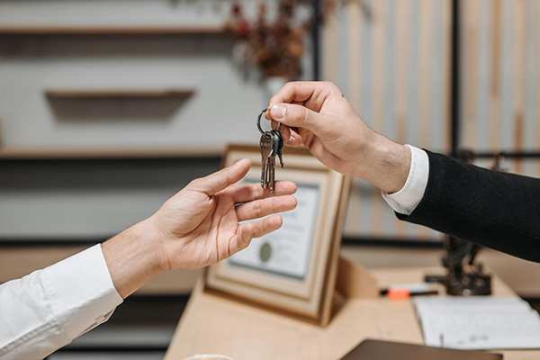 Photo - Handing the keys to a property manager