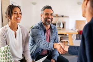 A Couple Choosing A Real Estate Agent
